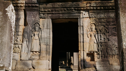Fototapeta na wymiar Stone rock carving art at Bayon Temple in Angkor wat complex, Siem Reap Cambodia