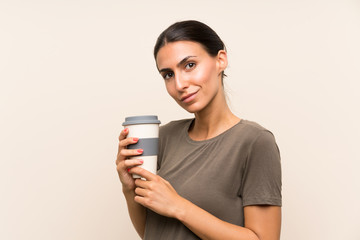 Young woman holding a take away coffee