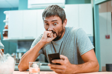 man talking on the phone at home