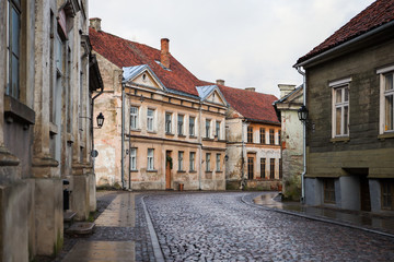 Obraz premium Beautiful small citybrick road, path street with interesting, old architecture.