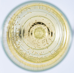 a glass of sparkling champagne is on the table. Contour light. Front view