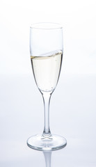 a glass of sparkling champagne is on the table. Contour light. Front view