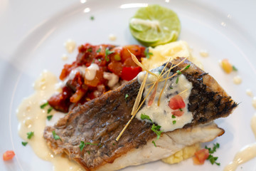  snow fish steak on white plate