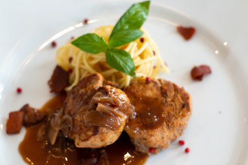  spaghetti with beef steak on plate