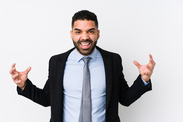 Young latin business woman against a white background isolated screaming with rage.