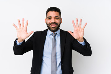 Young latin business woman against a white background isolated showing number ten with hands.