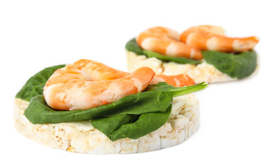 Puffed rice cakes with shrimps and basil isolated on white