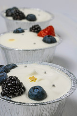 Cheesecakes stand near a garland, glowing stars