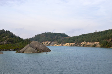 Chalk quarry artificial lakes in autumn season. Technogenic open pit is known as the Belarusian Maldives, which is in great demand among tourists from around the world