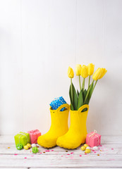 Happy Easter. Congratulatory easter background. Easter eggs and flowers.
