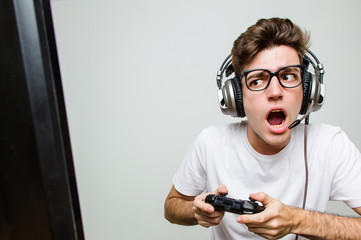 Teenager caucasian man playing computer games