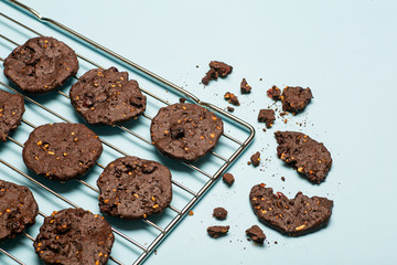 Homemade gluten-free chocolate chip cookies with cereals, nuts and organic cocoa. Cookies and pastries from rye flour on a colored background. Gluten free concept