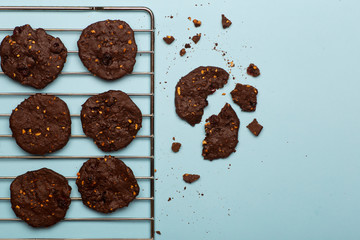 Homemade gluten-free chocolate chip cookies with cereals, nuts and organic cocoa. Cookies and pastries from rye flour on a colored background. Gluten free concept
