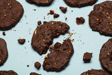 Homemade gluten-free chocolate chip cookies with cereals, nuts and organic cocoa. Cookies and pastries from rye flour on a colored background. Gluten free concept