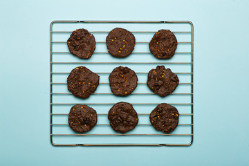 Homemade gluten-free chocolate chip cookies with cereals, nuts and organic cocoa. Cookies and pastries from rye flour on a colored background. Gluten free concept