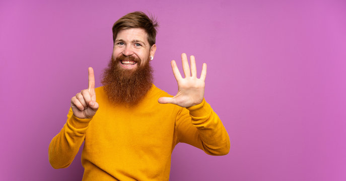 Redhead man with long beard over isolated purple background counting six with fingers
