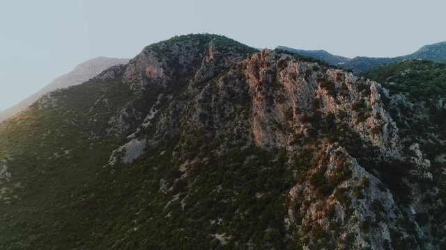 Rocky mountains around Greek river Acheron valley at sunset. Aerial, drone video. 