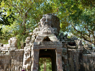 Fototapeta premium Stone rock door gate ruin at Banteay Kdei, part of the Angkor wat complex in Siem Reap, Cambodia