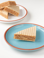 Fresh home made waffle cake with condensed milk. On a white background.