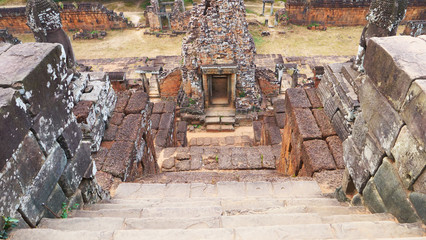 Stone rock ladder at Ancient buddhist khmer temple architecture ruin of Pre Rup in Angkor Wat complex, Siem Reap Cambodia.