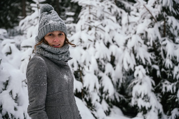 Fototapeta na wymiar Young woman on vacation in a snowy landscape