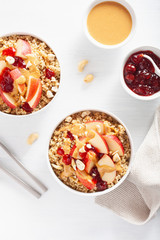 apple peanut butter quinoa bowl with jam and cashew for healthy breakfast