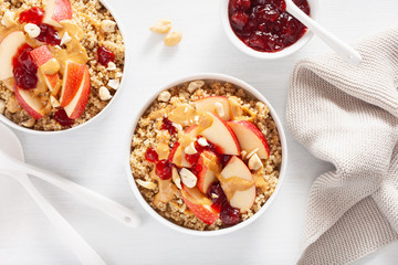 apple peanut butter quinoa bowl with jam and cashew for healthy breakfast