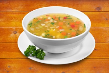 Bowl of delicious vegetable soup on a table