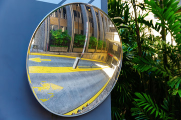 Obraz na płótnie Canvas traffic mirror at the driveway of an underground parking garage