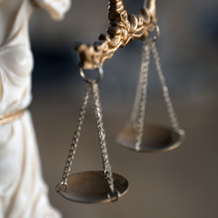 Symbol of law and justice on wooden table in lawyer office