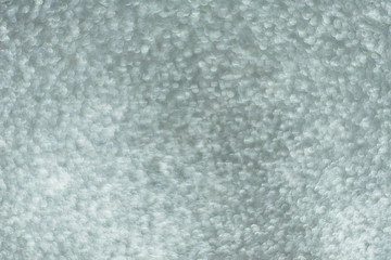 Silver background Abstract Bokeh Christmas. Shiny silver defocused glitter background with copy space