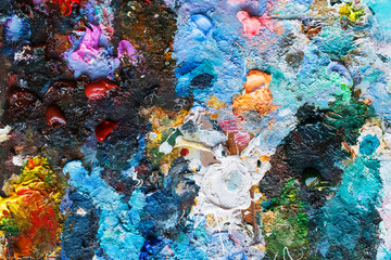 Naklejka na ściany i meble Artist's palette of oil paints close-up. Creative background in