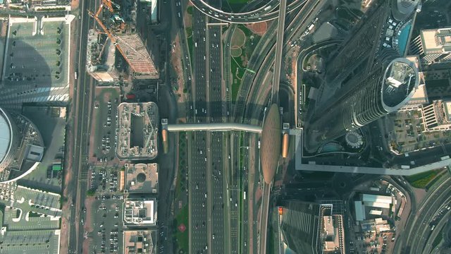 Aerial down view of a busy city highway interchange in Dubai Downtown, UAE