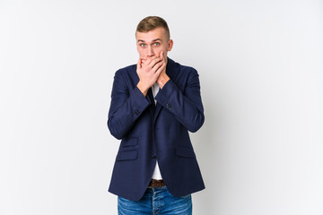 Young business caucasian man shocked covering mouth with hands.