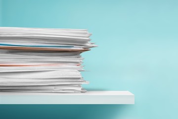 Stack of a paper document and postal envelope