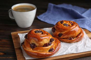 Delicious pastries and coffee on wooden table