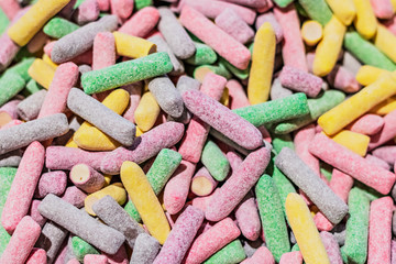 Background from multi-colored candies in a candy bar. Selective focus.