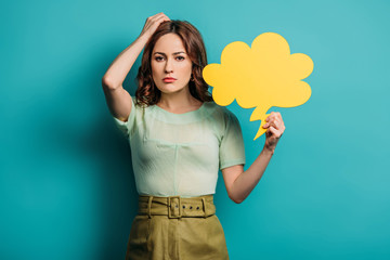 thoughtful woman touching head while holding thought bubble on blue background