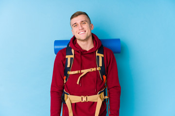 Young traveller caucasian man happy, smiling and cheerful.