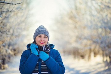 Fototapeta na wymiar portrait of a young happy girl woman in winter clothes