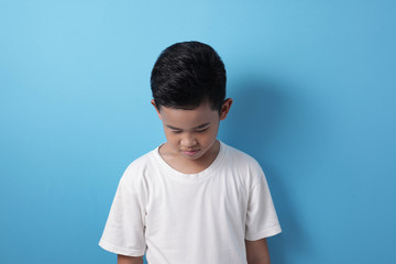 Sad Asian boy crying