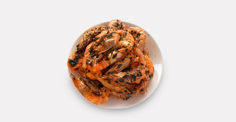 Grilled shrimp on a white plate