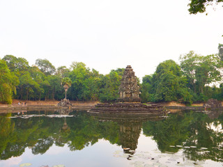 Fototapeta premium Landscape view with reflection of Neak Pean or Neak Poan in Angkor Wat complex, Siem Reap Cambodia