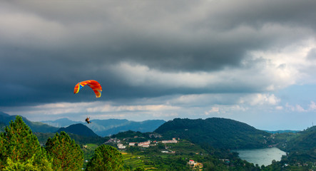 Paragliding in a picturesque valley, naukuchiatal, Uttarakhand, India