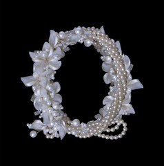Frame of pearls and flowers on black