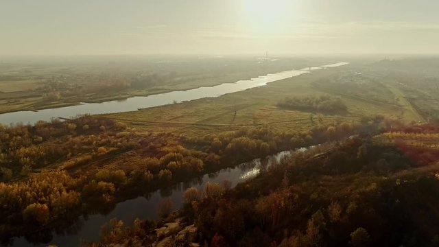 Vistula river (Wisla) and Pepper Hills (Gory Pieprzowe) at sunset. Autumn in Poland, Sandomierz. Aerial, drone video.