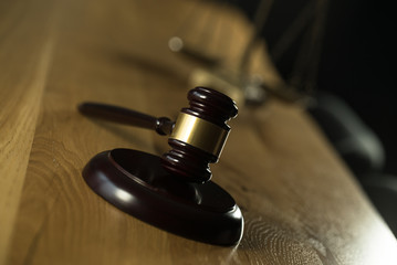 Symbol of law and justice on wooden table in lawyer office