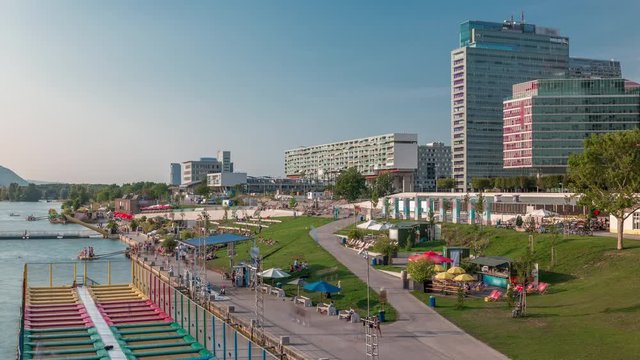 View of Copa Cagrana timelapse (or Copa Beach), an area by the Neue Donau (New Danube) in the 22th district of Vienna, with bars, restaurants and free-time activities. Green lawn and skyscrapers