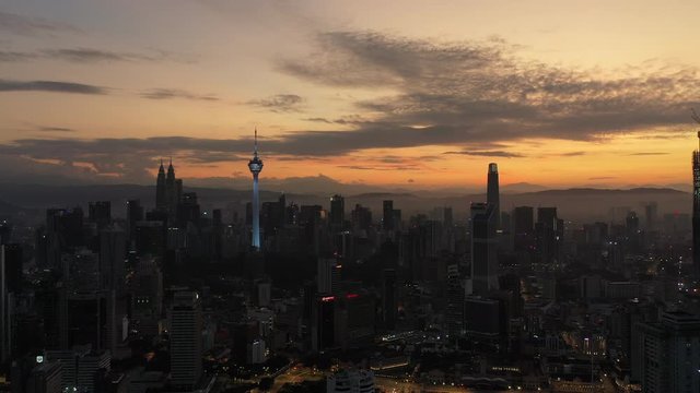 4k establishing cinematic b-roll shot of sunrise at Kuala Lumpur city skyline. 