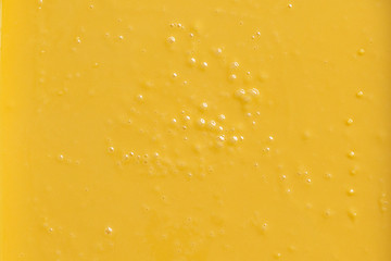 Cream honey or confiture orange color. Background, texture, close up, top view